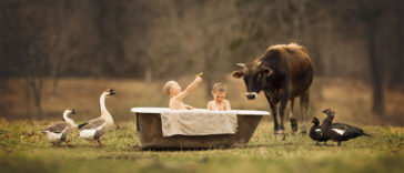 Cutest pictures of Kids and Barnyard animals together will make you wish you were raised up at a barn