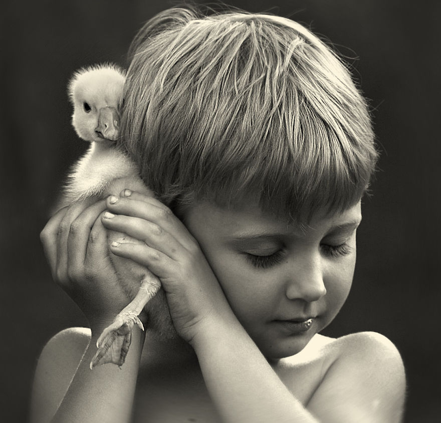 A Russian Mother On Her Farm Takes Magical Pictures of Her Two Kids With Animals