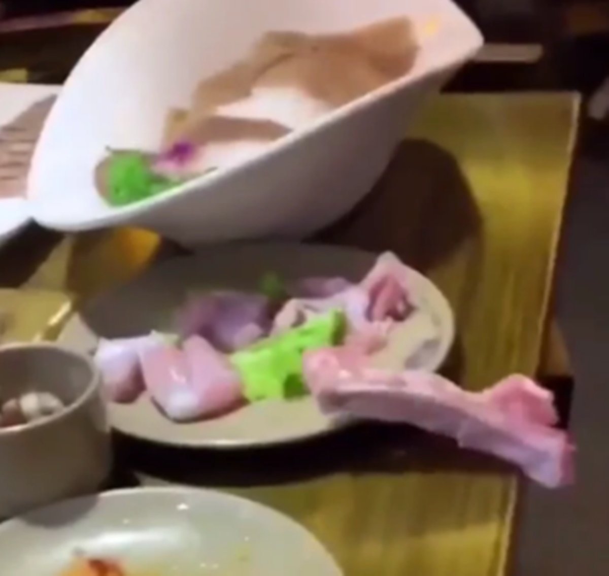 Disturbing Video Shows A Raw Piece Of Chicken Crawling Off Of A Restaurant Table