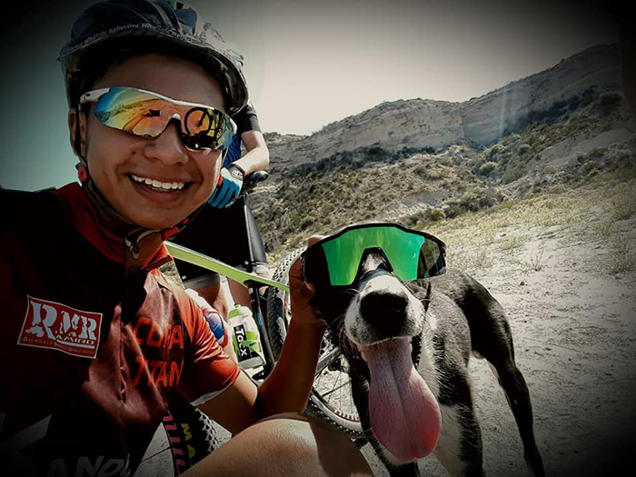 Cyclist Stops During His Practice For Helping The Dehydrated Dog And Carries It To Shelter On His Back
