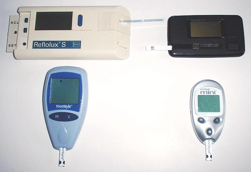 Several handheld blood glucose meters used to measure blood sugar
